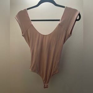 Express  Bodysuit with Criss Cross back Color: light pink Size - medium